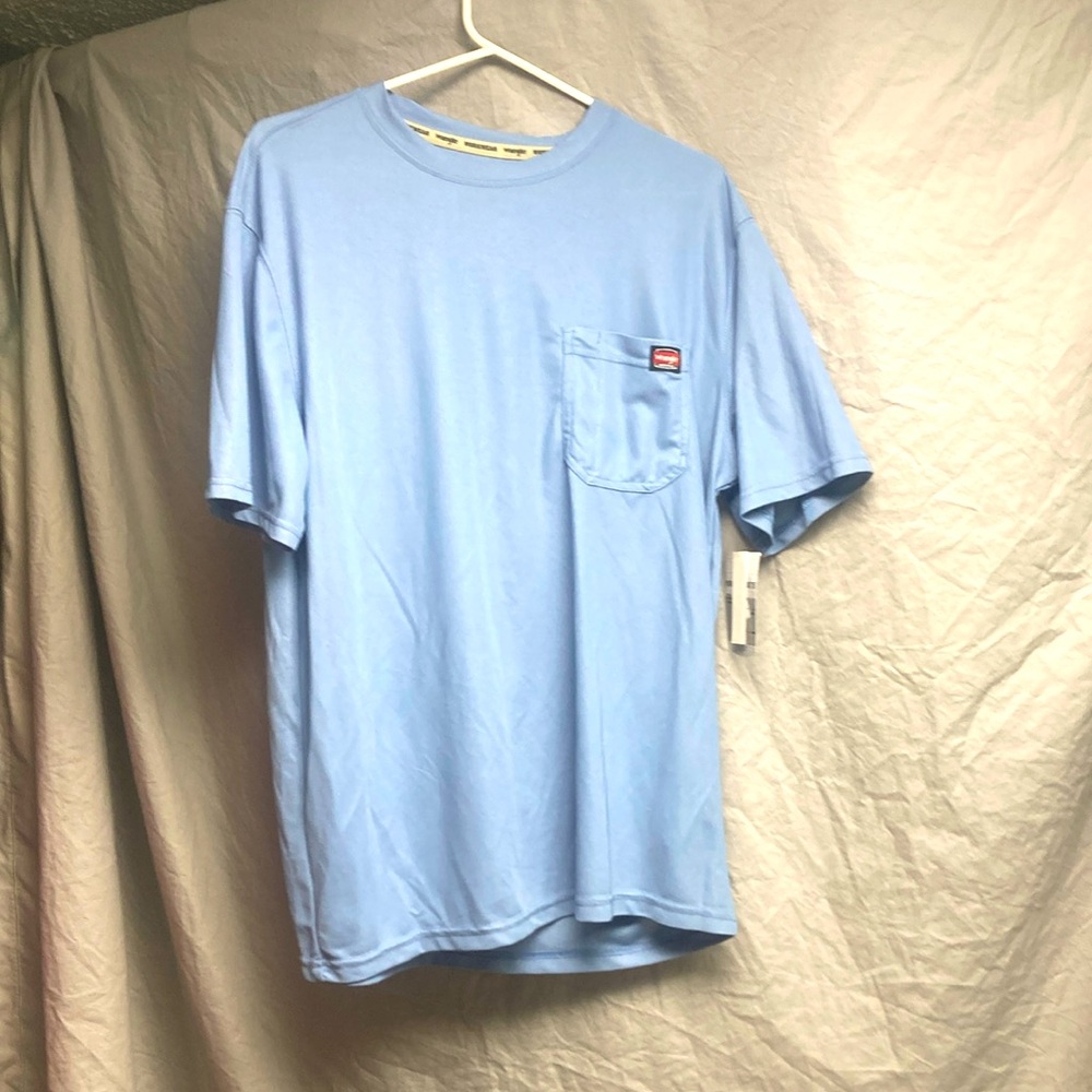 I’m selling a baby blue wrangler workwear tee shirt with tags still on it.